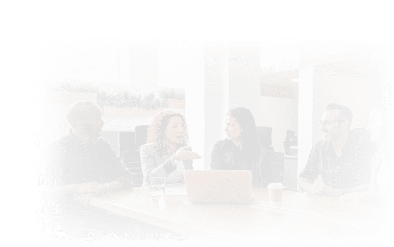 Diverse team of businesspeople having a meeting together around a conference table in an office